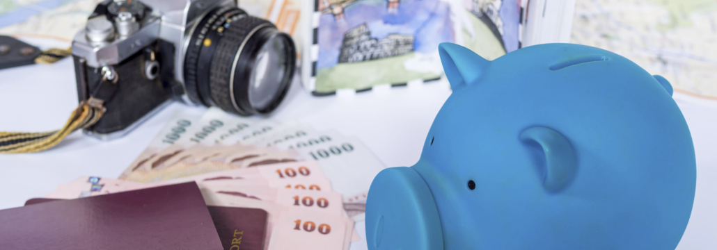 Piggy bank with dream destination sketch, passport book/  saving