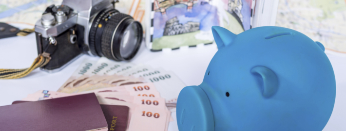 Piggy bank with dream destination sketch, passport book/  saving